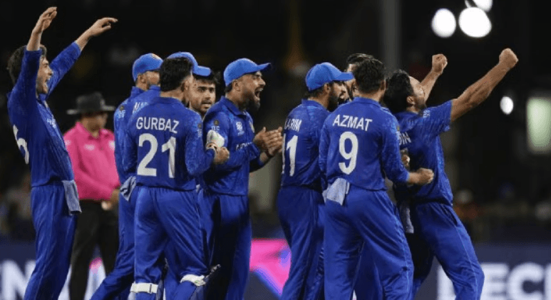 Afghanistan players celebrate an Australia wicket during the men's T20 World Cup cricket match at the Arnos Vale Ground, Kingstown, Saint Vincent and the Grenadines on Sunday. (AP Photo)